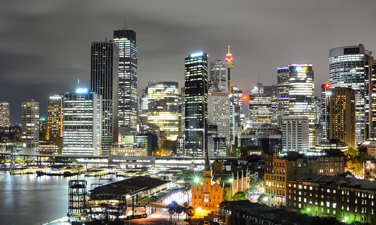 Illuminated night view of Sydney and Circular Quay.