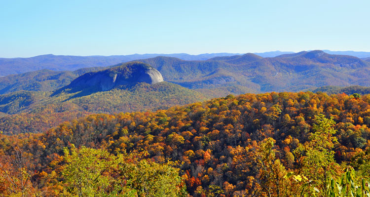 Looking Glass Rock and autumn foliage in the Appalachian Mountains, as seen from the Blue Ridge Parkway.
